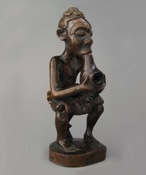 Seated pipe smoker from the Kuba