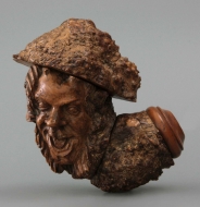 Grotesque pipe with clown heads