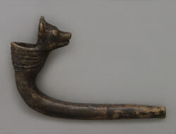 Elbow pipe with animal figure 